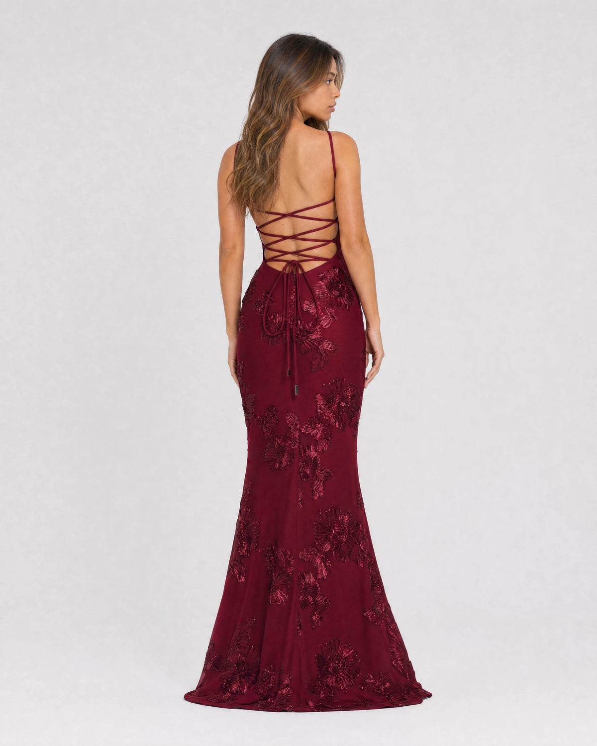 Flora embroidered floral mermaid gown in burgundy, back view with lace-up