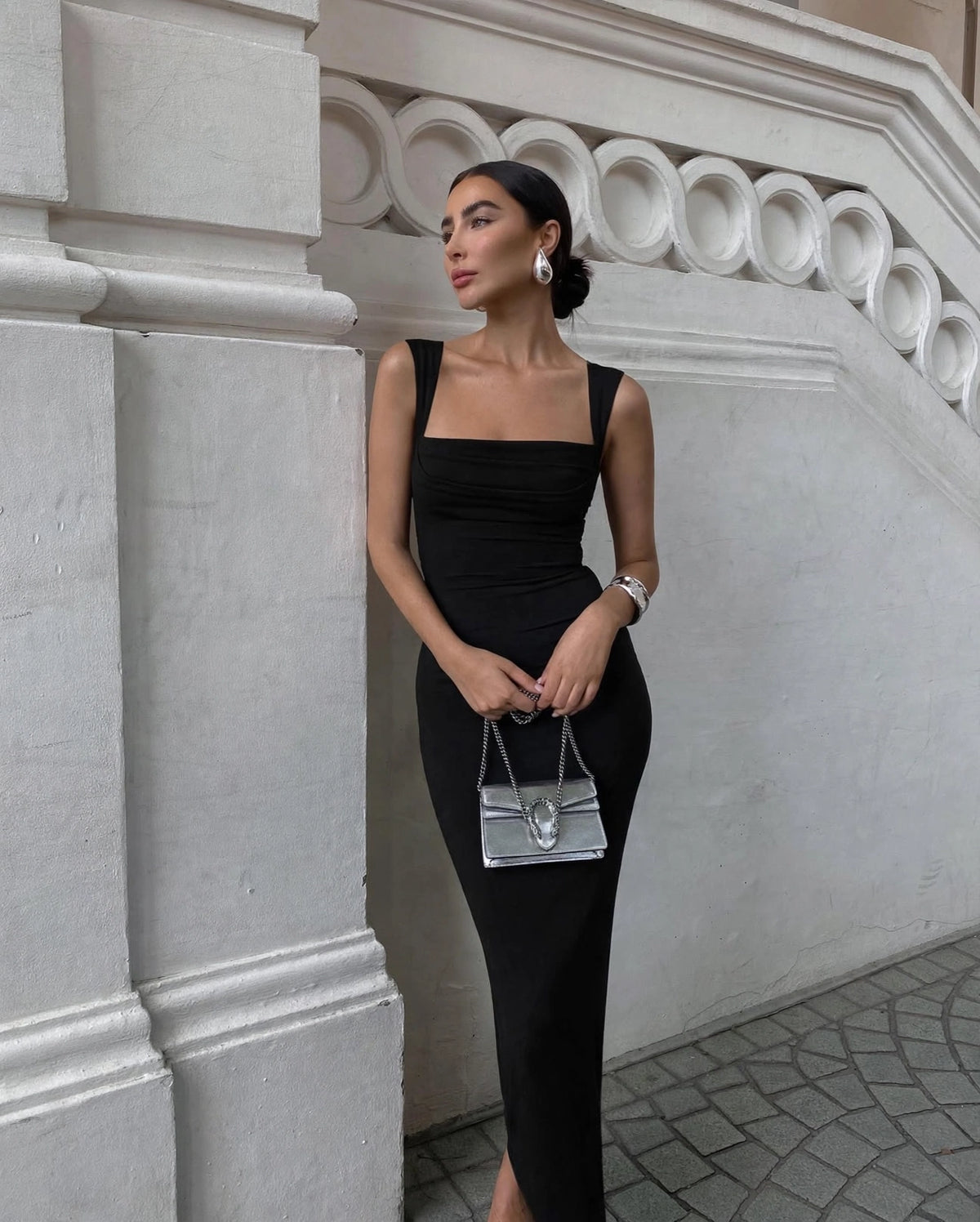 Celine black square neck maxi dress with pleated bust - front view, outdoor setting